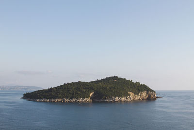Scenic view of sea against clear sky, island 