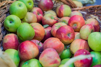 Close up of red ripe apples in a basket at the farmer's market