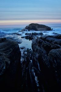 Scenic view of sea against sky during sunset