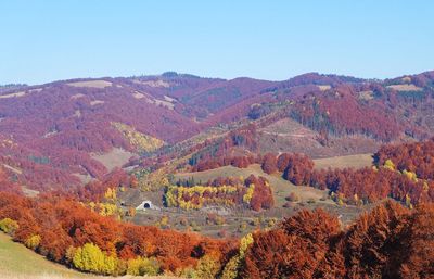 Scenic view of mountains against clear sky during autumn