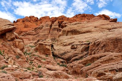 Rock formations on mountain against sky