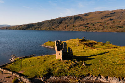 View of the ruined ardvreck castle over loch assynt, sutherland, north west highlands, scotland