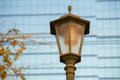 Low angle view of lamp post against sky