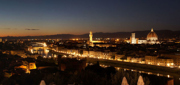 Illuminated cityscape at night