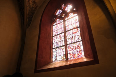 Low angle view of glass window in temple