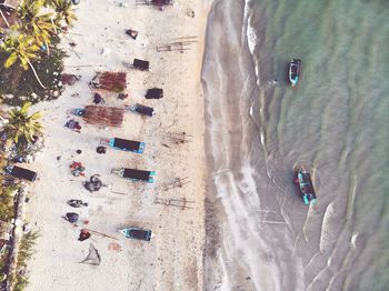 High angle view of people relaxing on beach