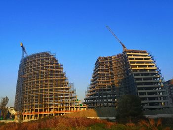 Low angle view of building against clear blue sky