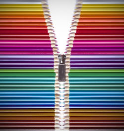Full frame shot of multi colored pencils over black background