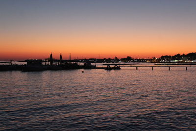 Scenic view of sea against orange sky