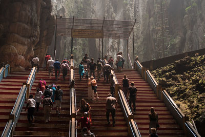 Low angle view of people on steps at batu caves