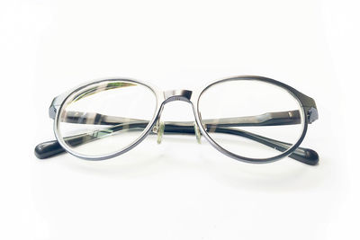 High angle view of eyeglasses against white background