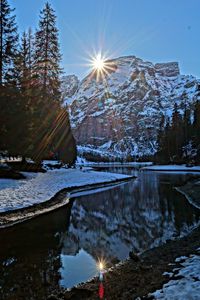 Scenic view of lake against sky during winter