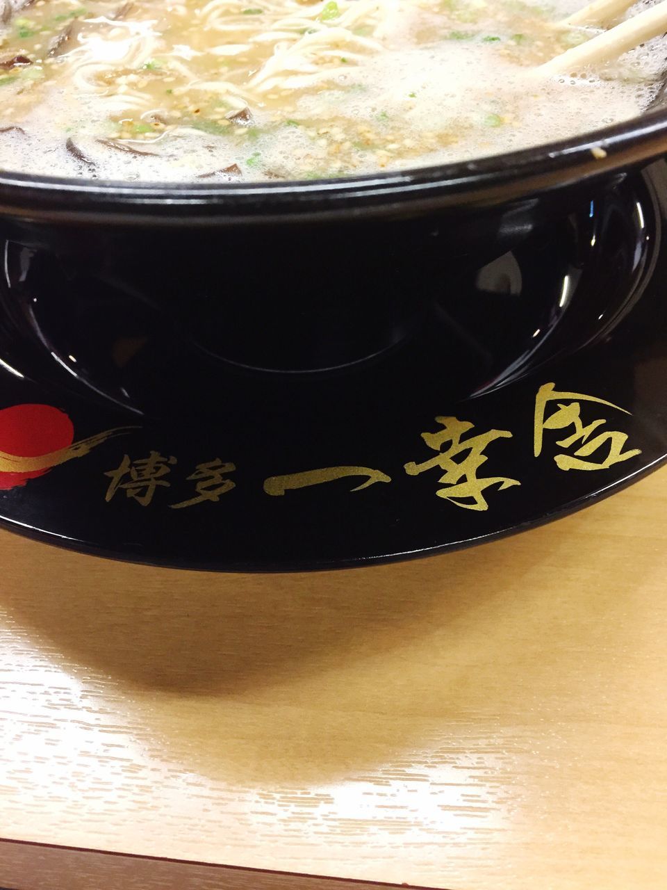 indoors, food and drink, drink, table, close-up, text, refreshment, high angle view, freshness, still life, western script, coffee cup, communication, part of, no people, spoon, cropped, cup, frothy drink, coffee - drink