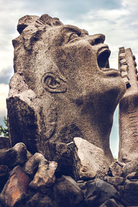 Low angle view of statue against sky