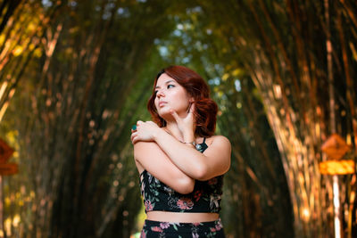 Portrait of a smiling young woman standing outdoors