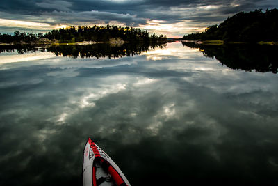 Reflection of clouds in water at sunset