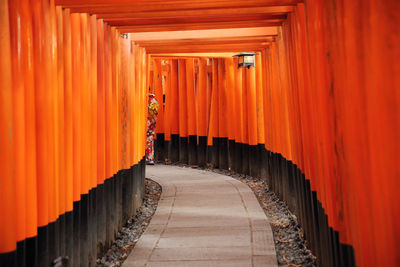 Corridor of building against orange sky