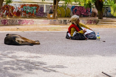 Senior woman relaxing on walkway