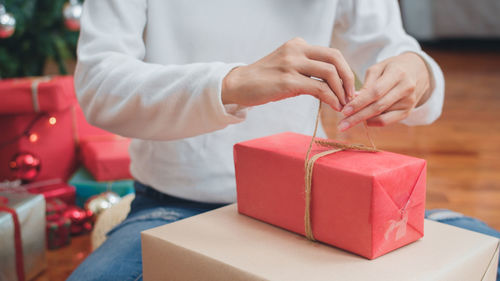 Midsection of woman holding toy blocks