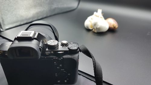 Close-up of camera on table