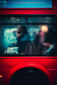 Reflection of man in car mirror