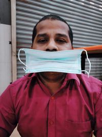 Close-up portrait of man wearing mask  on his mouth