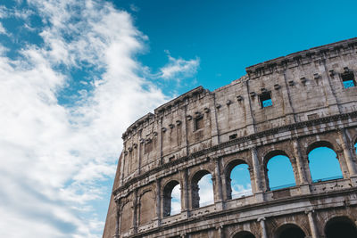 Low angle view of coliseum against sky