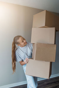 Portrait of cute girl with cardboard box