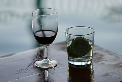 Close-up of wine glasses on table