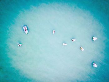 Aerial view of boats in blue sea