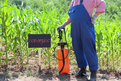 Low section of man working on field