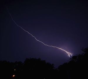 Low angle view of lightning in sky at night