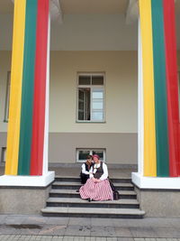 People sitting outside building