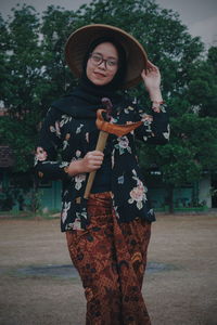 Woman standing against the wall