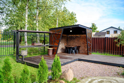 Picnic area with barbecue grill and table and chairs.