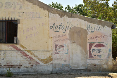 Graffiti on wall of old building