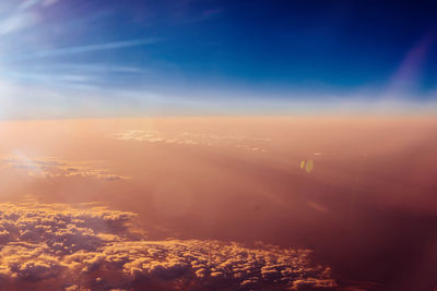 Aerial view of cloudscape against sky during sunset