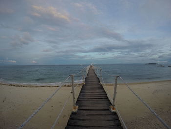 Pier over sea against sky