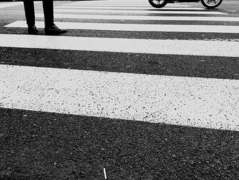 Low section of people walking on street