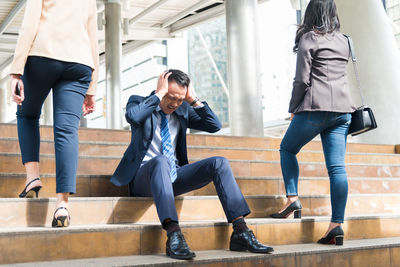 Business people on steps