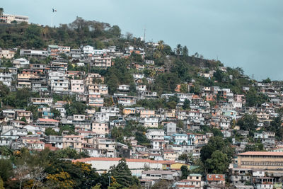 Buildings in town against sky