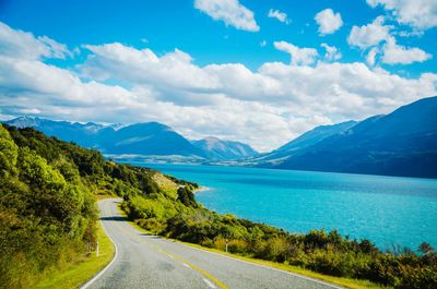 Road by sea against mountain