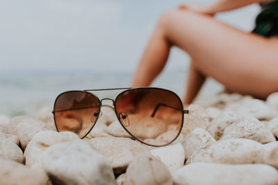 Close-up of sunglasses on stones