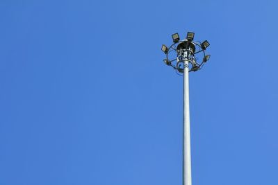 Low angle view of street light against clear blue sky