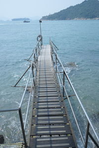 High angle view of pier over sea against sky