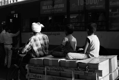 Rear view of people entering bus