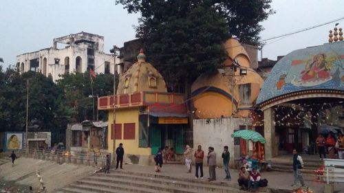 People walking by buildings in city