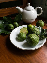 Close-up of fruits in plate on table