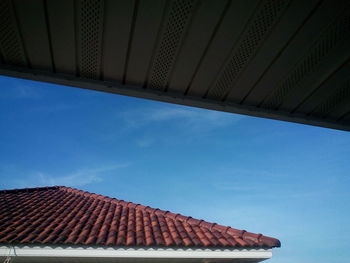 Low angle view of built structure against blue sky