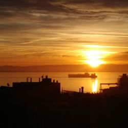 Scenic view of sea against orange sky